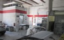 A neat and clean and professional refinishing department is located at Car Guys Collision Repair - Palm Harbor, Palm Harbor, FL, 34684