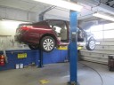 Professional vehicle lifting equipment at Francesco Auto Body, Inc., located at Yonkers, NY, 10703, allows our damage estimators a clePrar view of all collision related damages