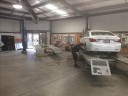 Professional vehicle lifting equipment at The Professionals Auto Body Works, located at Modesto, CA, 95356, allows our damage estimators a clear view of all collision related damages.