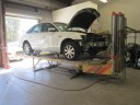 Professional vehicle lifting equipment at Hughes Auto Body, located at Santa Barbara, CA, 93111, allows our damage estimators a clear view of all collision related damages.